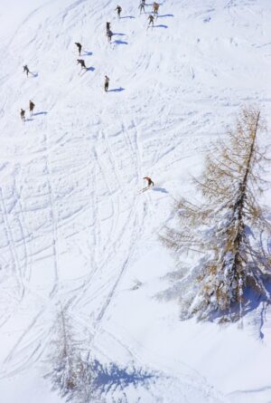 A Group Of Skiers On The Piste